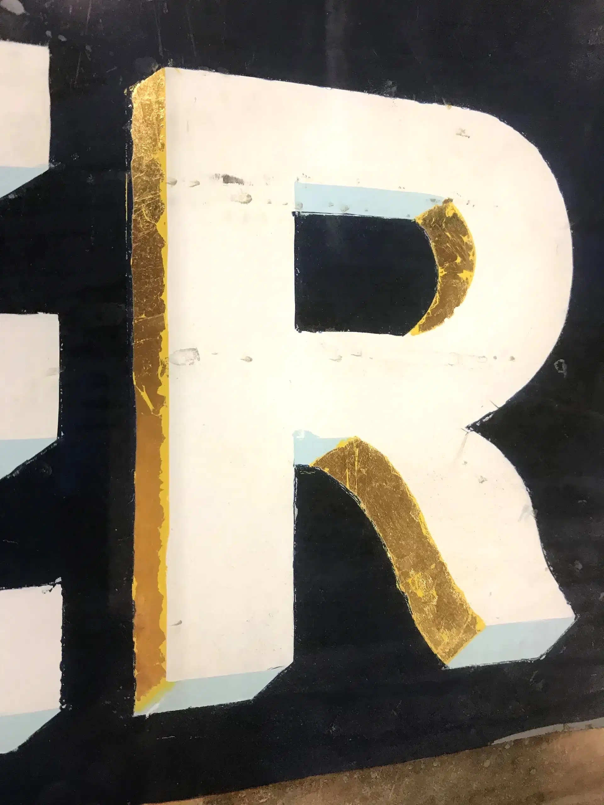 Gold lettering on glass